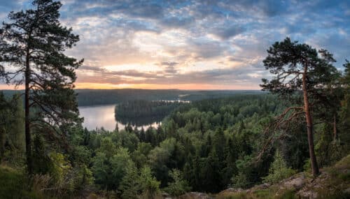 Scenic view with lake and sunset at summer morning in National Park Aulanko, H&auml;meenlinna, Finland